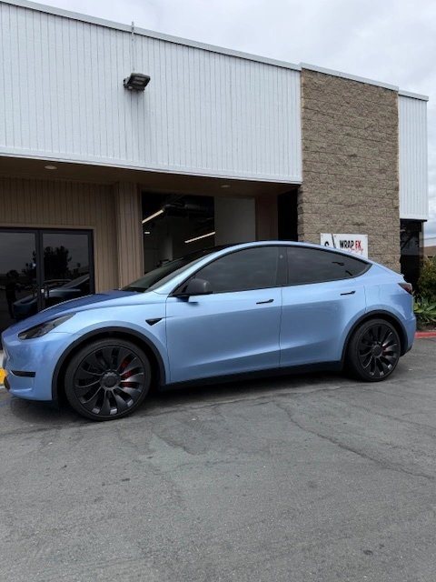 Tesla Model Y with a cool blue color-change wrap by WrapFX San Diego