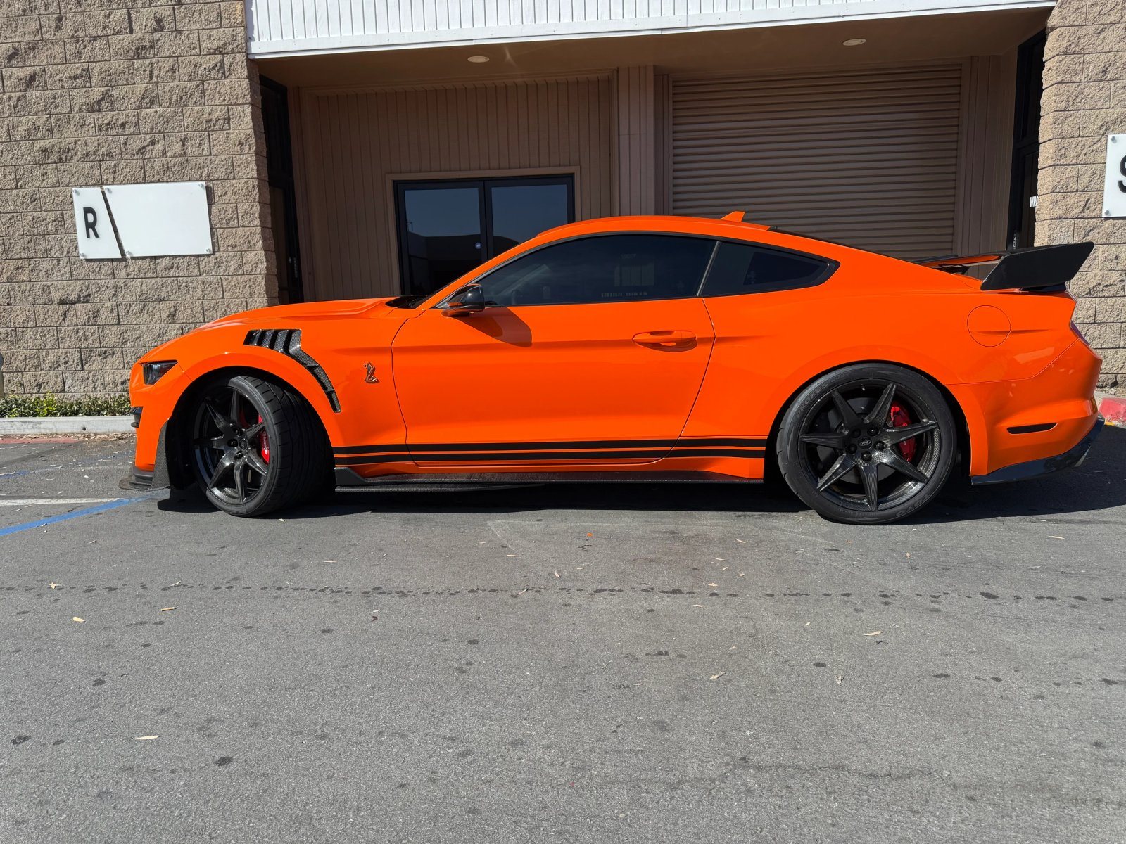 Ford Mustang Shelby GT500 with an orange finish by WrapFX San Diego