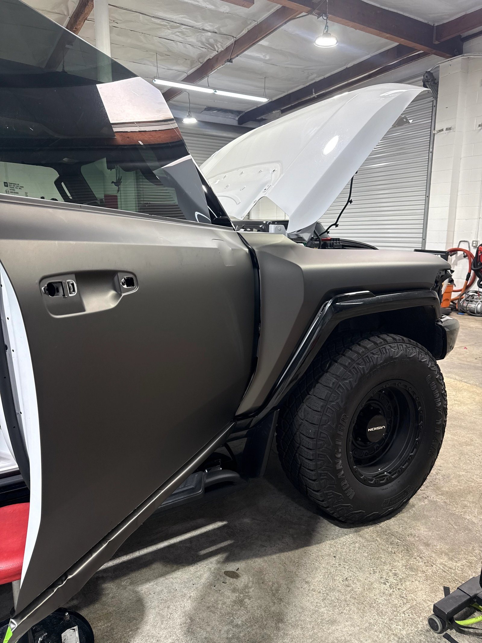 Toyota 4Runner receiving a satin charcoal vinyl wrap at WrapFX San Diego